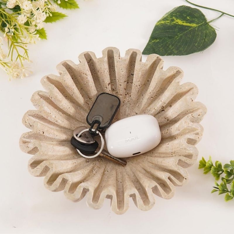 6 inches travertine ruffle bowl holding pens, keys, and coins on an office desk
