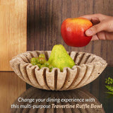 10 inches travertine scalloped bowl filled with apples and grapes fruit on kitchen island