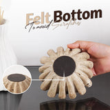 Close-up of the felt base on 6 inches travertine ruffle bowl to protect surfaces