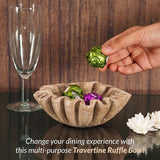 6 inches travertine ruffled bowl holding wrapped candy on modern coffee table
