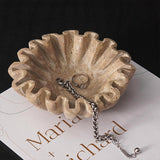 6 inches travertine decorative bowl used to store rings, bracelets and jewelry on a dresser