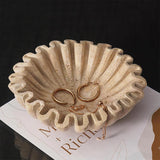 8 inches travertine decorative bowl used to store rings, bracelets and jewelry on a dresser