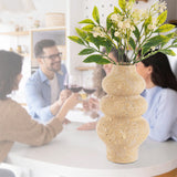 Travertine Flower Vase styled on a table in a minimalist dining room setting