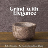 Angled view of oceanic marble mortar and pestle showcasing round stone bowl and pestle shape