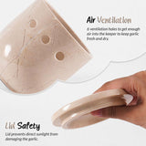 Close-up of beige marble garlic keeper showing 6 circular ventilation holes for air circulation — natural stone garlic keeper keeps garlic fresh and dry by Speshstones