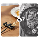 Black marble chopstick rests used as knife rest and fork rest on wooden dining table beside pasta dish — marble knife rest keeps cutlery off table surface compared to cutlery resting directly on plate — natural stone dining accessory by Speshstones