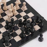 15-inch black and travertine marble chess set with handcrafted pieces and extra queen on side
