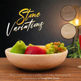 Close-up of travertine marble serving bowl highlighting smooth surface and natural stone details.