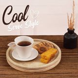 Round travertine tray used as coffee tray with cup and biscuits