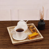 Square travertine tray used as coffee tray with cup and biscuits