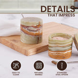 Close-up of green marble salt and pepper container showing easy-to-clean natural stone and stainless steel spoon