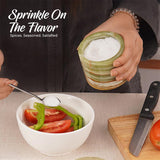 green marble salt cellar used for seasoning on kitchen countertop