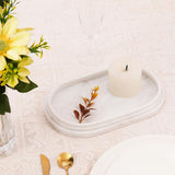 Decorative marble tray in white used as a candle holder or coffee table centerpiece
