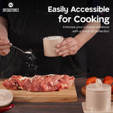 Hand using verona marble salt cellar for seasoning meat – ideal for cooking and easy access to salt