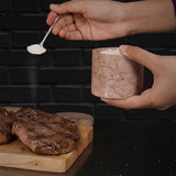 marinara marble salt cellar used for seasoning on kitchen countertop