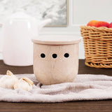 Verona marble travertine garlic and onion holder placed with fresh vegetables on kitchen counter