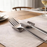 Oceanic marble chopstick rests used as knife rests at formal Western dining table — dinner knife and fork resting across natural stone holders in place setting by Speshstones