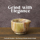 onyx green Speshstones mortar and pestle set displayed on a modern kitchen countertop with spices