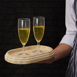 Oval travertine serving tray used to carry drinks outdoors