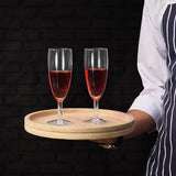 Round travertine serving tray used to carry drinks outdoors