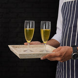 Square travertine serving tray used to carry drinks outdoors