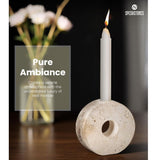 Travertine candlestick holders decorating a dinner table setup
