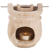 travertine marble oil burner and wax warmer for home fragrance with white background