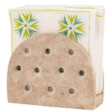 Natural travertine napkin holder with holes for kitchen, bathroom, and tabletop use with smooth finish and round design.