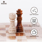 Close-up of travertine and red marble chess pieces on board showing easy to clean surface, smooth edges, and natural stone material