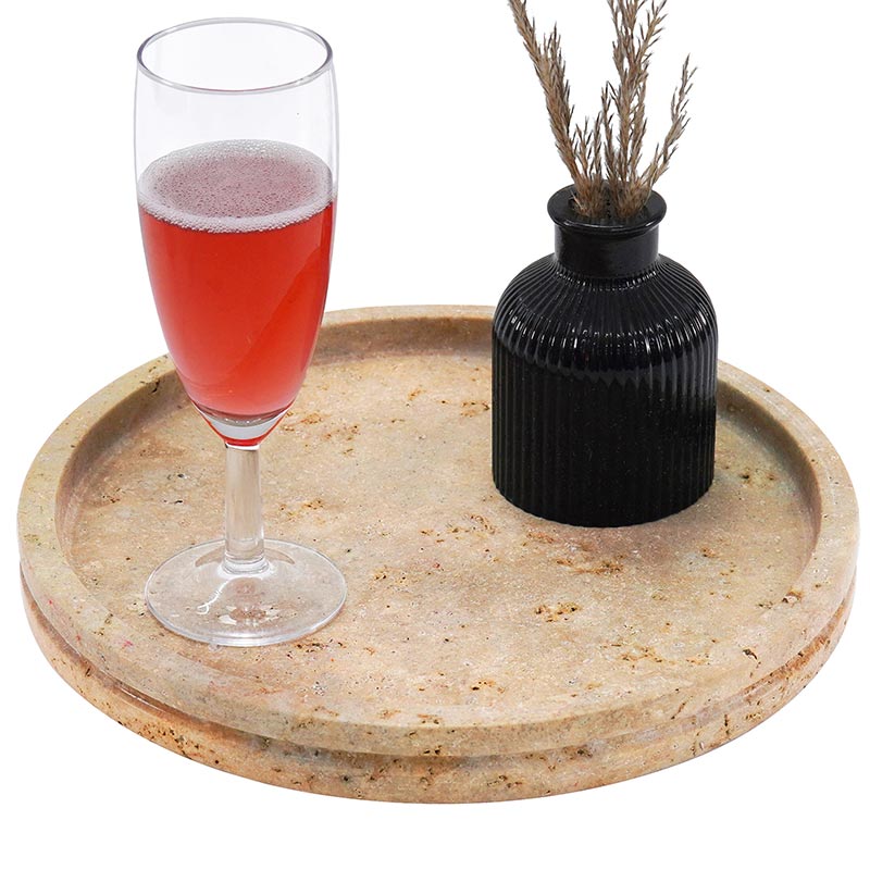 Travertine round marble tray with decorative items in white background