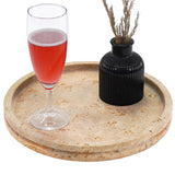 Travertine round marble tray with decorative items in white background