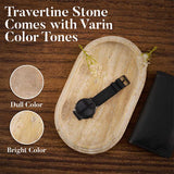 Oval travertine tray showing bright and dull natural color tone variations with glass placed on top