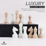 Close-up of travertine and white marble chess pieces