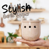 Verona marble garlic holder with garlic bulbs on countertop