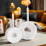 white marble candle holders used as living room table decor