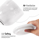 Close-up of white marble garlic keeper showing 6 circular ventilation holes for air circulation — natural stone garlic keeper keeps garlic fresh and dry by Speshstones