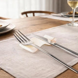 White onyx marble chopstick rests used as knife rests at formal Western dining table — dinner knife and fork resting across natural stone holders in place setting by Speshstones